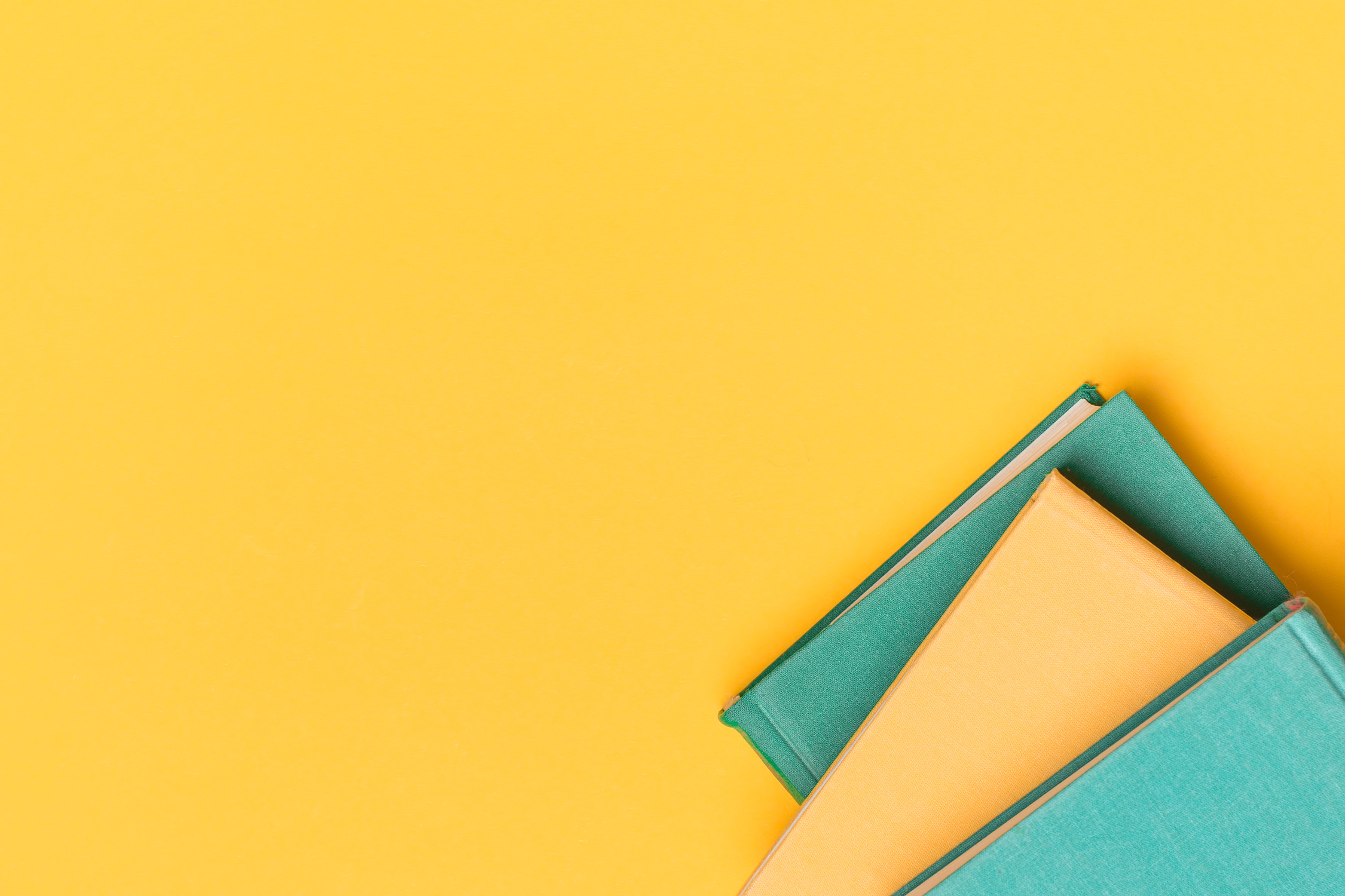 Educational concept, books on a yellow background with a place for the layout